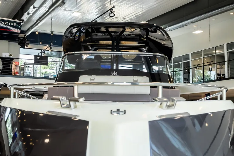 Slide: The Image of 2024 Invictus GT320S luxury boat displayed in a modern showroom. - 9