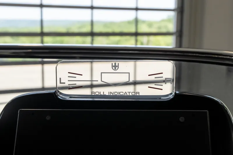 Slide: The Image of 2024 Invictus GT320S roll indicator gauge in a modern vehicle interior. - 21