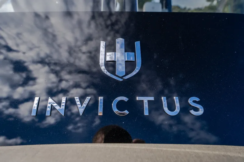 Slide: The Image of 2024 Invictus GT320S logo with reflective sky background. - 37