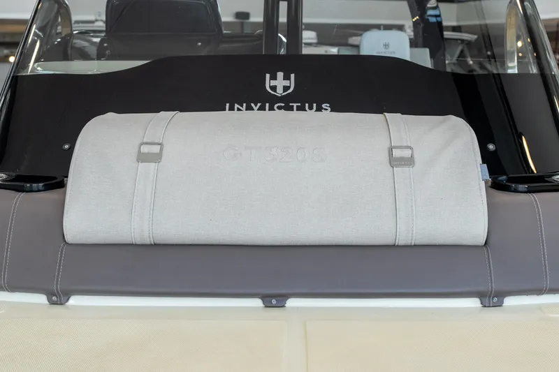 Slide: The Image of 2024 Invictus GT320S boat interior with branded upholstery and sleek design elements. - 31