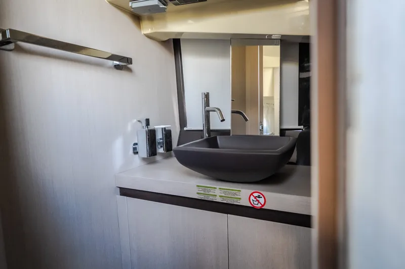 Slide: The Image of Modern bathroom interior of 2024 Invictus GT320S yacht with sleek sink and fixtures. - 53