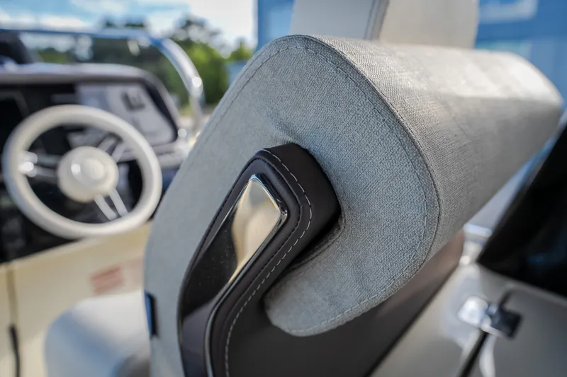 Slide: The Image of 2024 Invictus GT320S boat interior, featuring a luxurious seat and steering wheel. - 24