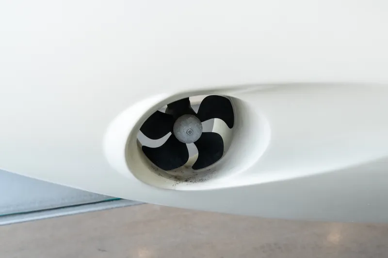 Slide: The Image of Close-up of 2024 Invictus GT320S boat propeller in white hull. - 38