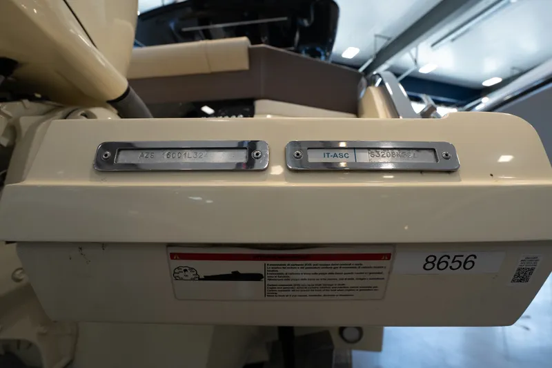 Slide: The Image of 2024 Invictus GT320S boat identification plates and warning label in a showroom. - 6