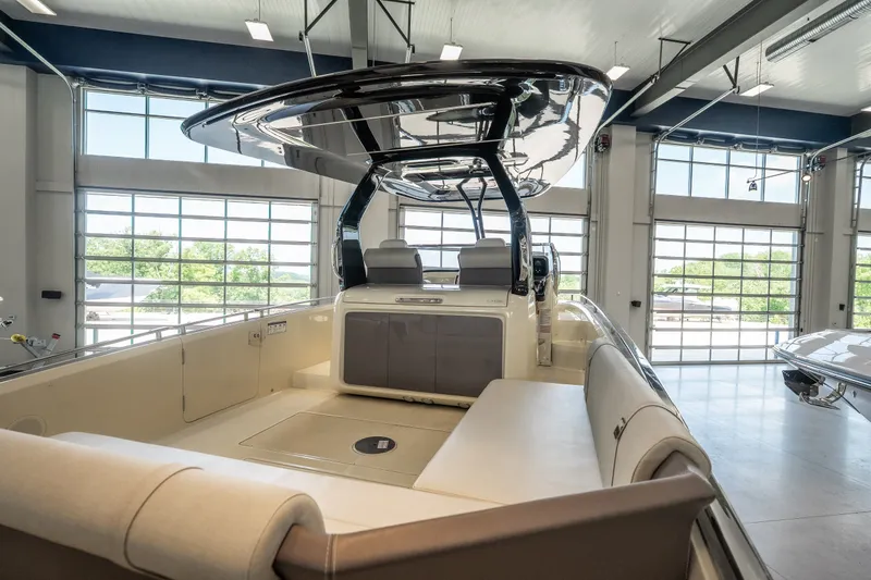 Slide: The Image of 2024 Invictus GT320S luxury boat interior in a modern showroom. - 12