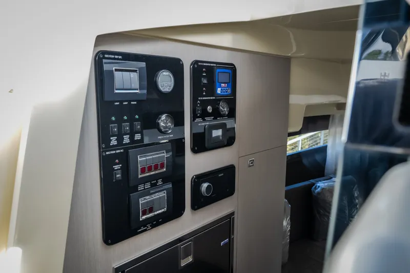 Slide: The Image of Control panel of 2024 Invictus GT320S yacht interior, featuring modern instrumentation. - 43