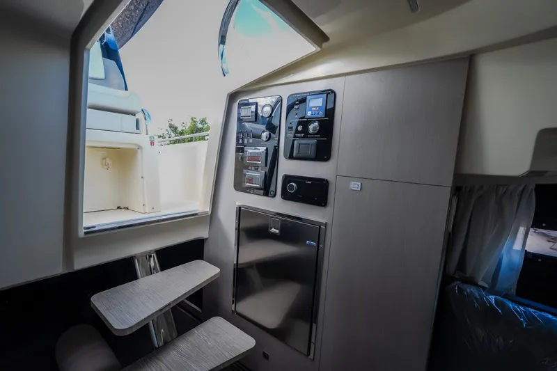 Slide: The Image of 2024 Invictus GT320S interior with control panels and seating area. - 51