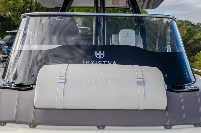 Slide: The Image of 2024 Invictus GT320S boat, sleek design with branded windshield and seating. - 35