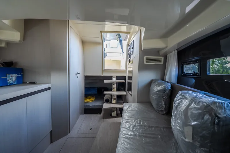 Slide: The Image of Interior of 2024 Invictus GT320S yacht, featuring modern seating and compact design. - 49