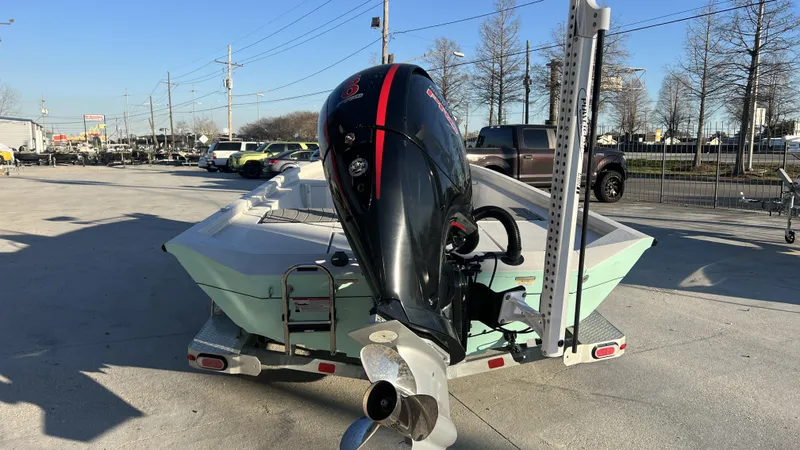 Slide: The Image of 2022 Vexus AVX2180CC boat with outboard motor on trailer in parking lot. - 13
