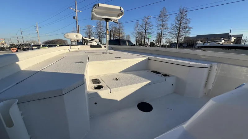 Slide: The Image of 2022 Vexus AVX2180CC boat deck with storage compartments and fishing rod holders. - 5