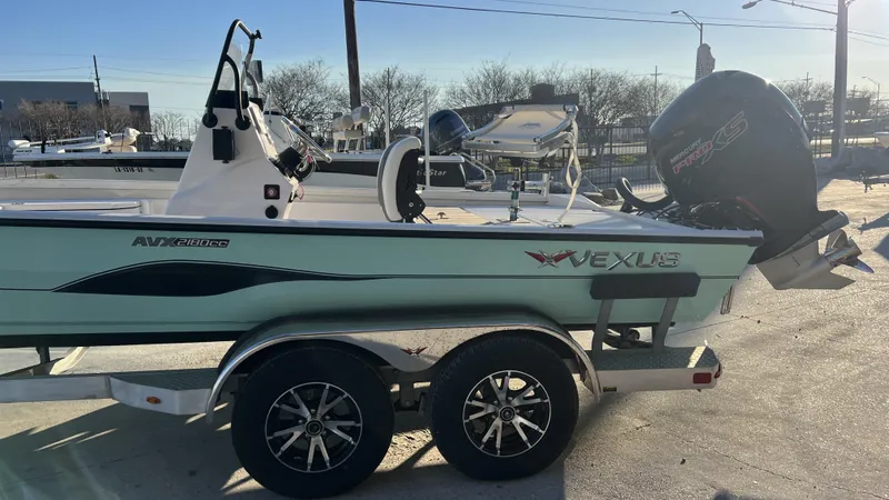 Slide: The Image of 2022 Vexus AVX2180CC boat on trailer with Mercury Pro XS outboard motor. - 6