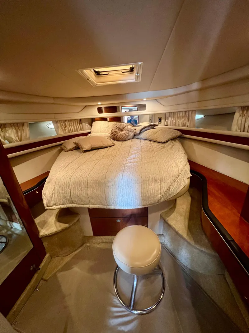 Slide: The Image of Luxurious bedroom interior of 2004 Sea Ray 46 Sundancer yacht with cozy bed. - 13
