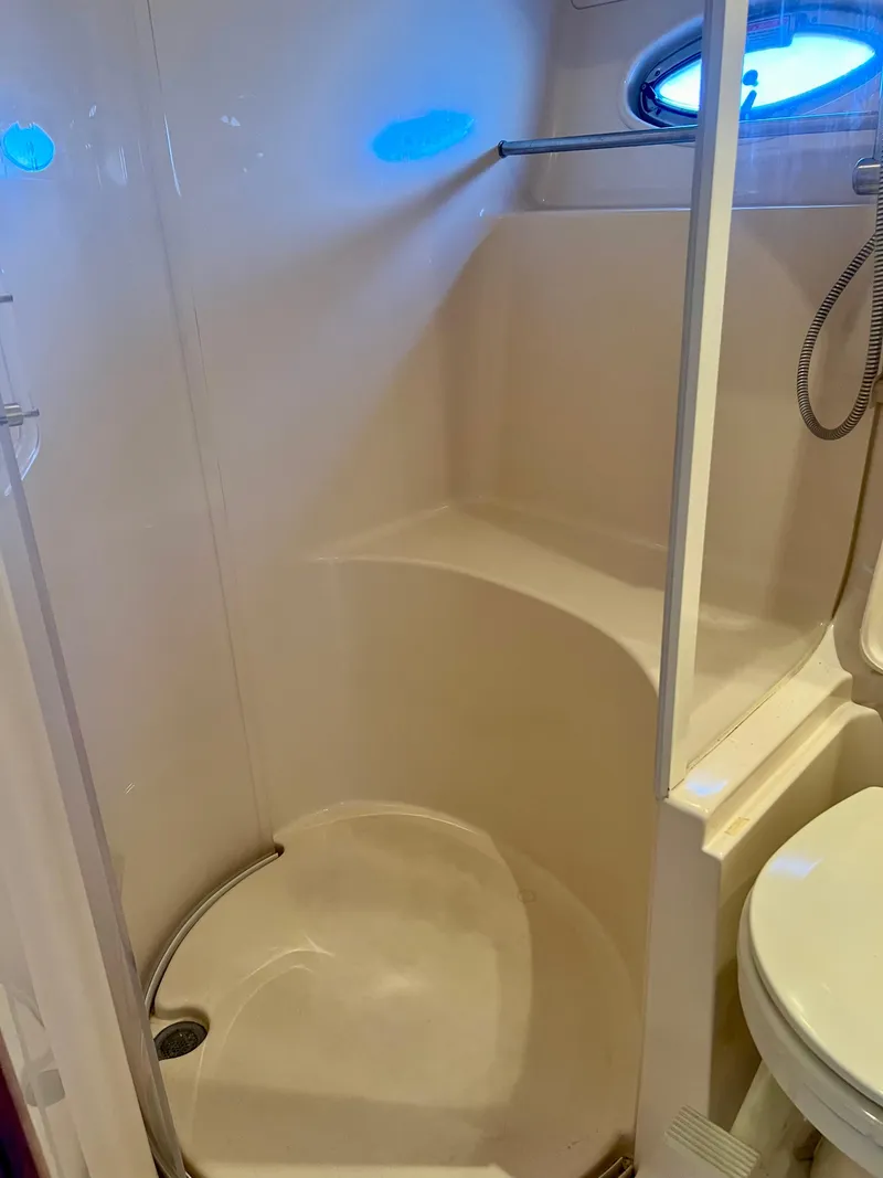 Slide: The Image of 2004 Sea Ray 46 SUNDANCER yacht bathroom with shower and toilet. - 15