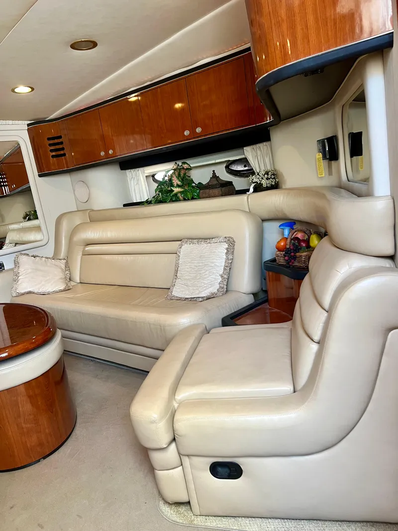 Slide: The Image of Luxurious interior of a 2004 Sea Ray 46 Sundancer yacht with leather seating and wooden accents. - 17