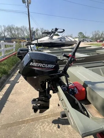 Slide: The Image of 2023 Polar Kraft DKJ1436 boat with Mercury outboard motor in a marina. - 3