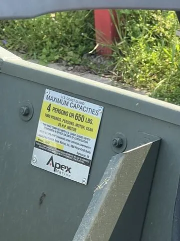 Slide: The Image of 2023 Polar Kraft DKJ1436 boat capacity label, 4 persons or 650 lbs, by Apex Marine. - 3