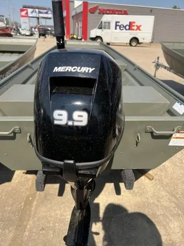 Slide: The Image of 2023 Polar Kraft DKJ1436 boat with Mercury 9.9 outboard motor at dealership. - 4
