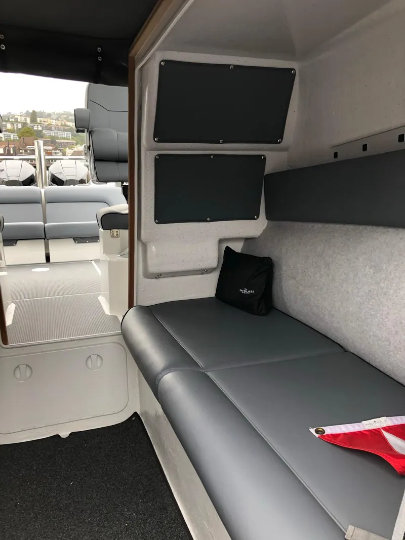 Slide: The Image of 2024 Protector 310 Targa interior with gray seating and modern design elements. - 9