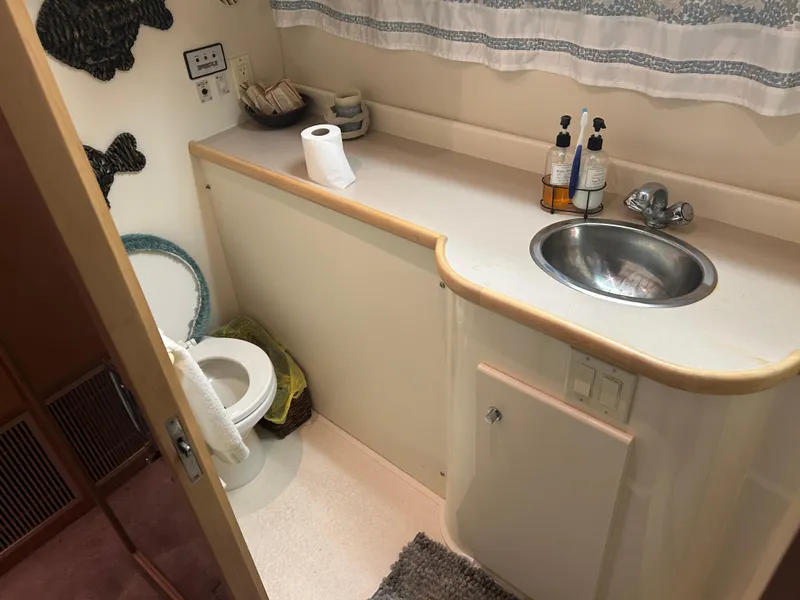 Slide: The Image of Bathroom interior of 1996 Carver 440 Aft Cabin Motor Yacht with sink and toilet. - 27