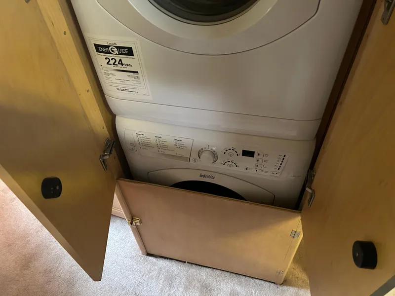 Slide: The Image of Stacked washer and dryer inside a 1996 Carver 440 Aft Cabin Motor Yacht. - 19