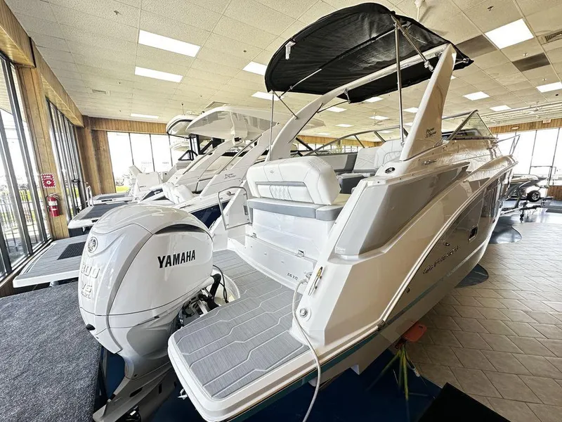 Slide: The Image of 2024 Regal 26XO boat with Yamaha outboard motor in showroom. - 0
