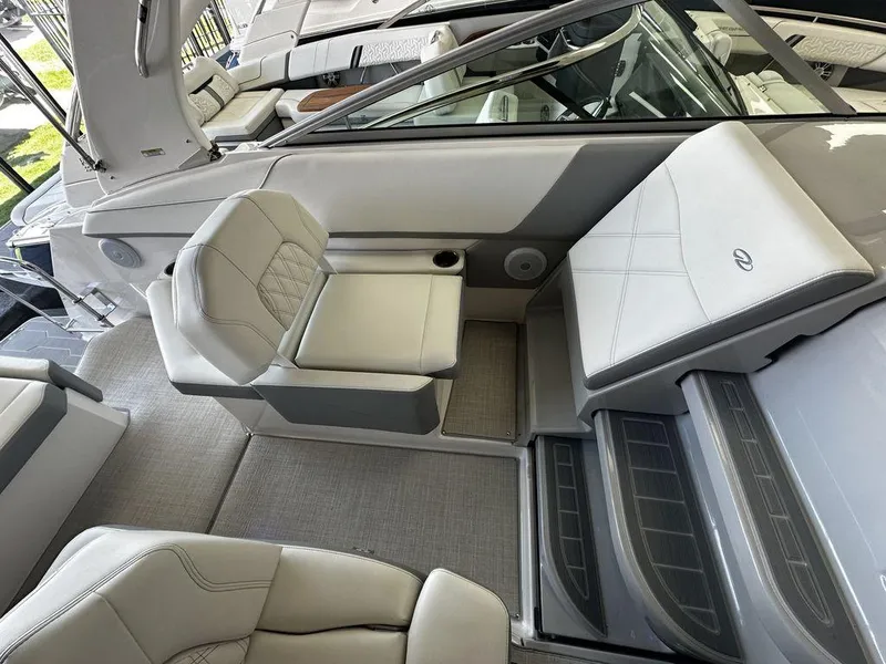 Slide: The Image of 2024 Regal 26XO boat interior with luxurious seating and modern design. - 10