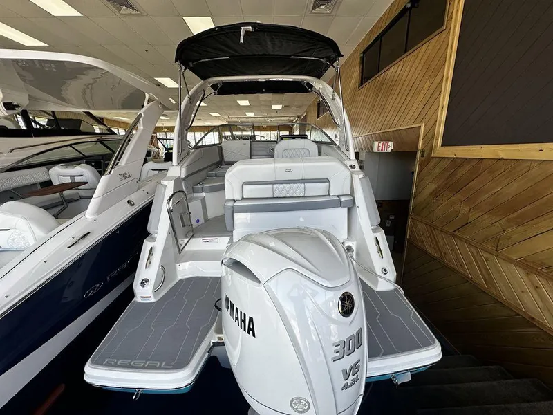 Slide: The Image of 2024 Regal 26XO boat with Yamaha 300 V6 engine in showroom. - 6