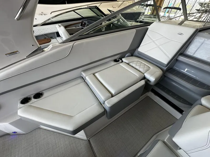 Slide: The Image of Luxurious seating area on the 2024 Regal 26XO boat with cup holders and modern design. - 9