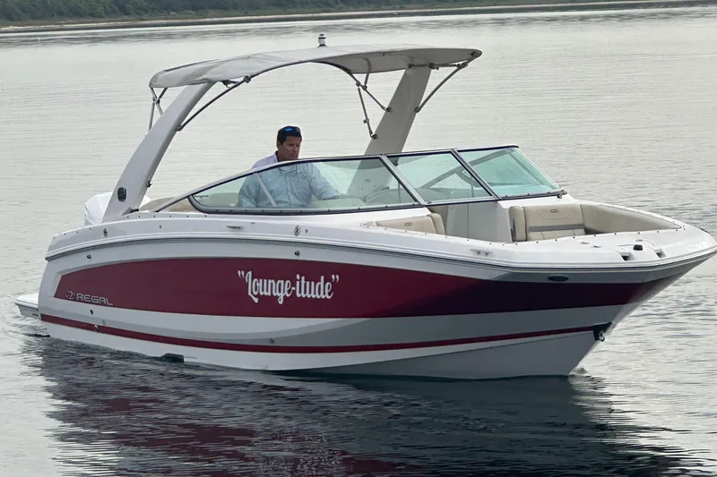 The Image of 2019 Regal 26 OBX boat named Lounge-tude on calm water. - 0