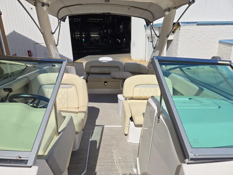 Slide: The Image of 2019 Regal 26 OBX boat interior with beige seating and open cockpit. - 14