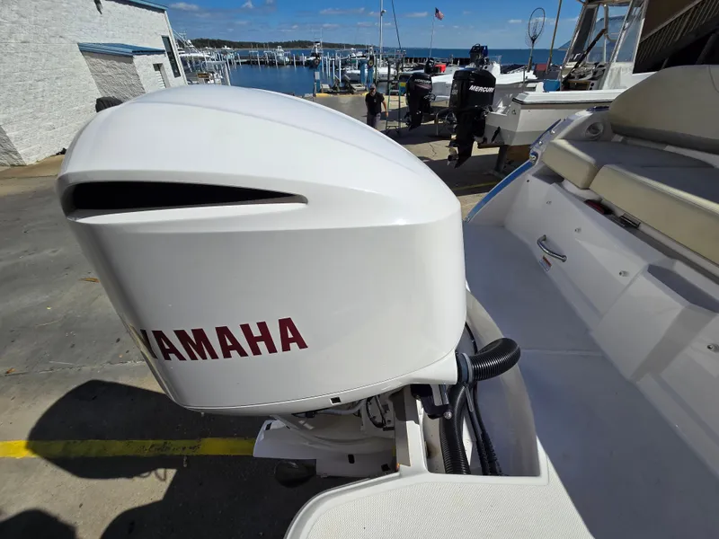 Slide: The Image of 2019 Regal 26 OBX boat with Yamaha outboard motor at marina. - 28