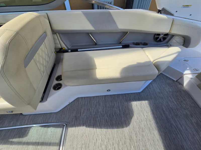 Slide: The Image of 2019 Regal 26 OBX boat interior with beige seating and cup holders. - 41