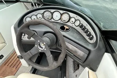 Slide: The Image of 1998 Supra Legacy boat dashboard with steering wheel and instrument panel. - 10