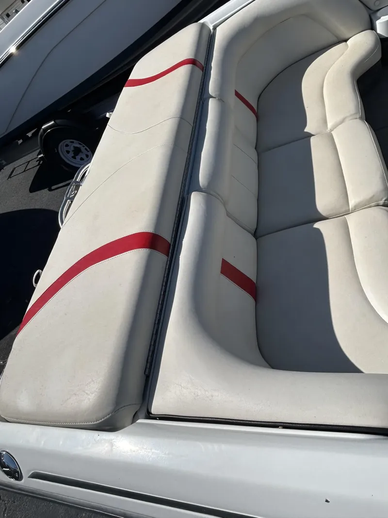Slide: The Image of 1998 Supra Legacy boat with white and red cushioned seating. - 3