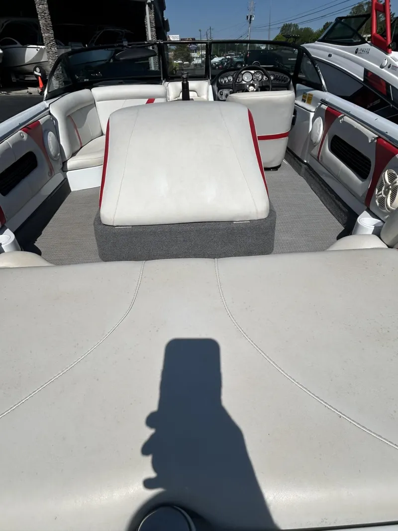 Slide: The Image of 1998 Supra Legacy boat interior with white and red seating. - 5