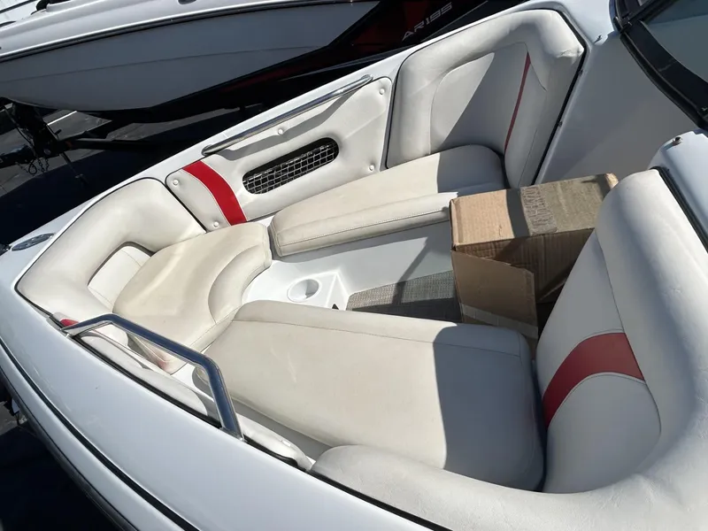 Slide: The Image of 1998 Supra Legacy boat interior with white and red seating. - 6