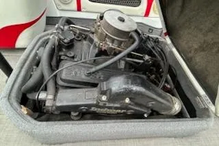 Slide: The Image of 1998 Supra Legacy engine compartment with detailed components and hoses. - 8