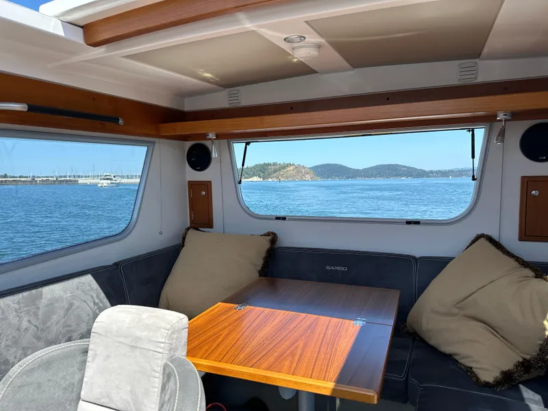Slide: The Image of Interior of 2020 Sargo 31 boat with scenic ocean view through windows. - 21