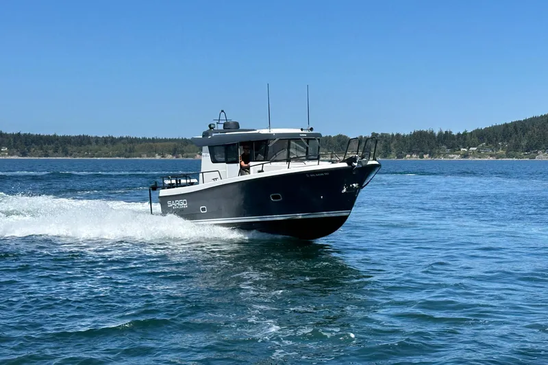 Slide: The Image of 2020 Sargo 31 boat cruising on a sunny day. - 3