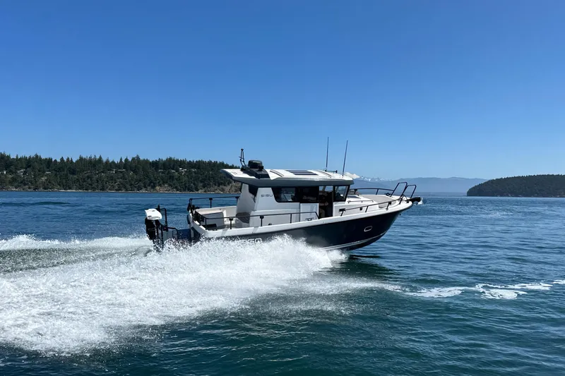 Slide: The Image of 2020 Sargo 31 boat cruising on a sunny day in open water. - 7
