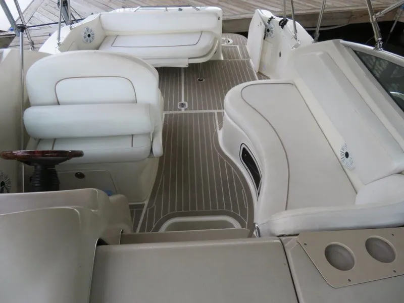 Slide: The Image of Interior of 2000 Sea Ray 270 DANCER boat with white seating and wood accents. - 3