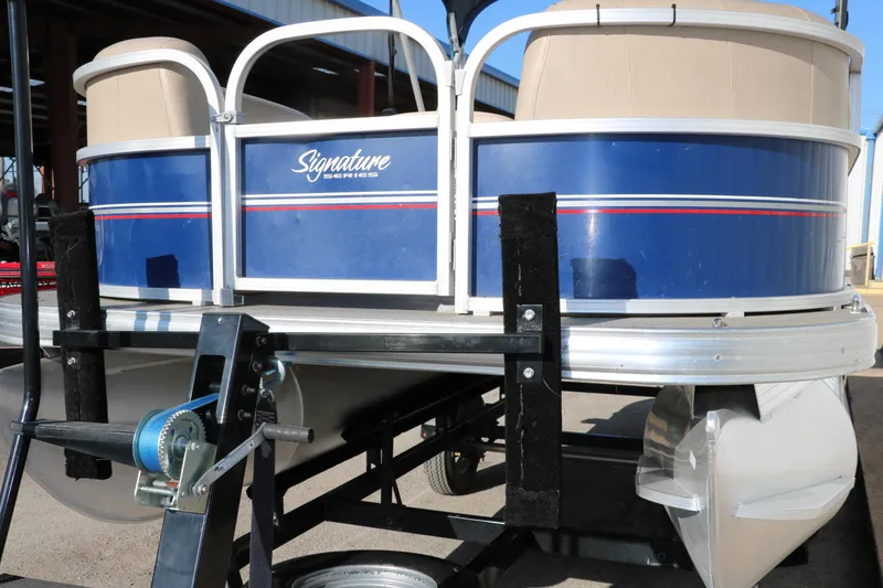 Slide: The Image of 2016 Sun Tracker Party Barge 18 DLX pontoon boat on trailer. - 11