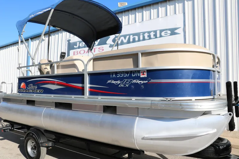 Slide: The Image of 2016 Sun Tracker Party Barge 18 DLX pontoon boat on trailer. - 14