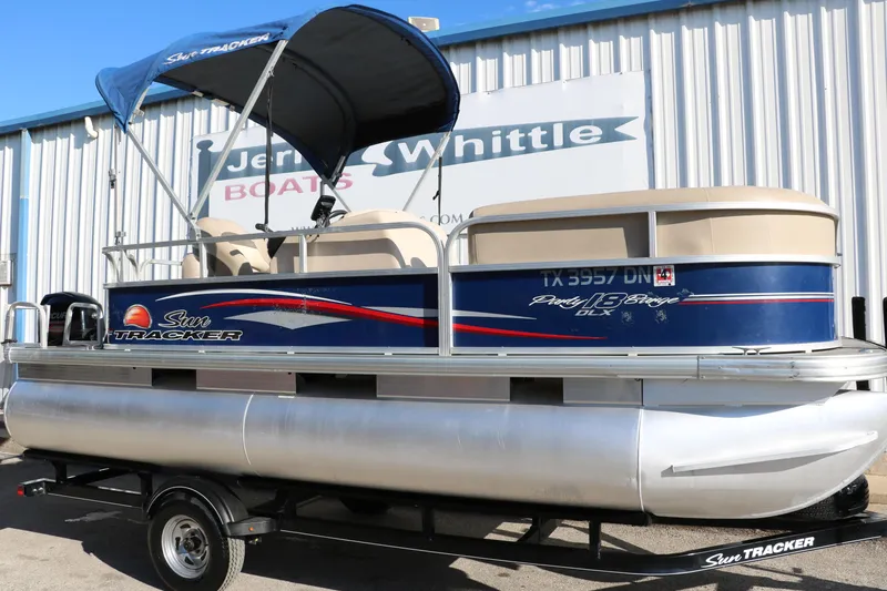 Slide: The Image of 2016 Sun Tracker Party Barge 18 DLX pontoon boat on trailer. - 15