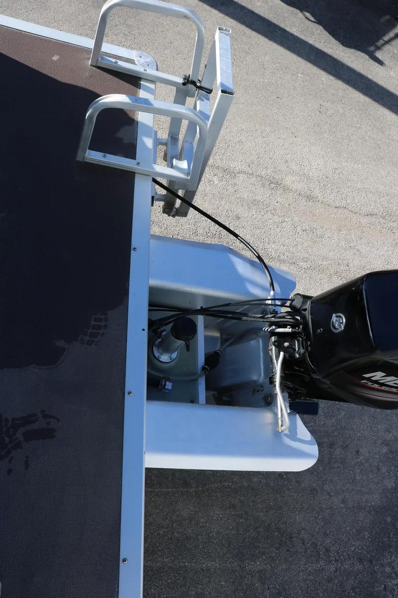 Slide: The Image of 2016 Sun Tracker Party Barge 18 DLX boat engine and rear deck. - 24