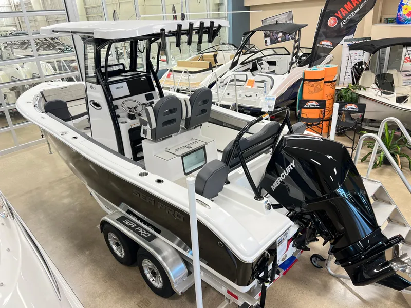 Slide: The Image of 2024 Sea Pro 245 FLX boat with Mercury engine on display in showroom. - 2