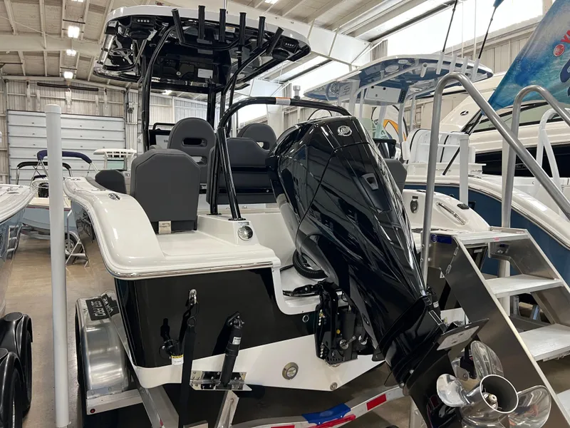 Slide: The Image of 2024 Sea Pro 245 FLX boat with powerful outboard motor in showroom. - 5