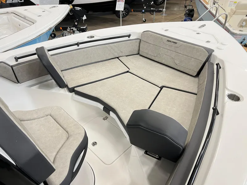 Slide: The Image of 2024 Sea Pro 245 FLX boat interior with cushioned seating. - 8
