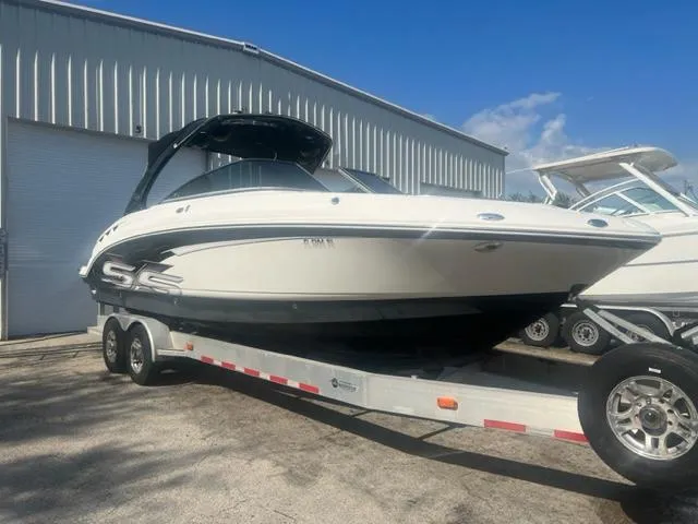 The Image of 2009 Chaparral 276 SSX boat on a trailer outside a storage facility. - 1